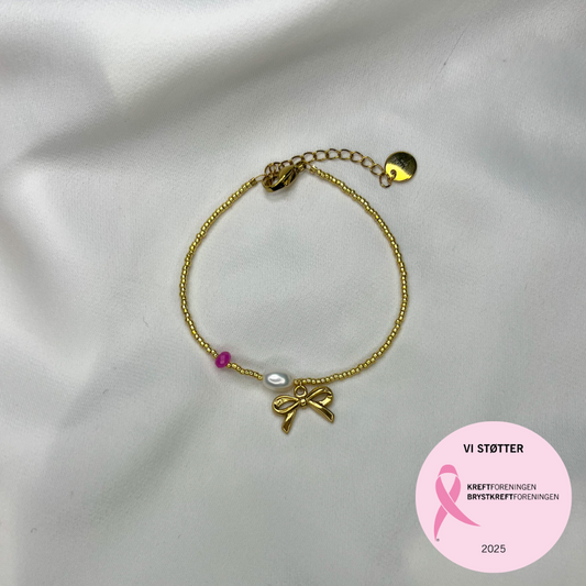 Rosa oktober – Armbånd – Sløyfe, perle og rosa hint