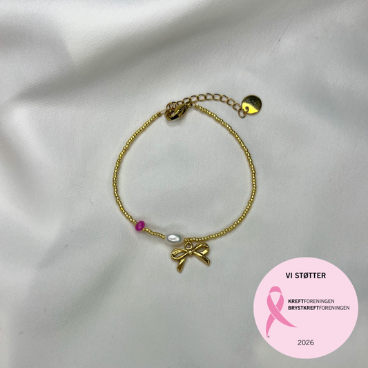 Rosa oktober – Armbånd – Sløyfe, perle og rosa hint